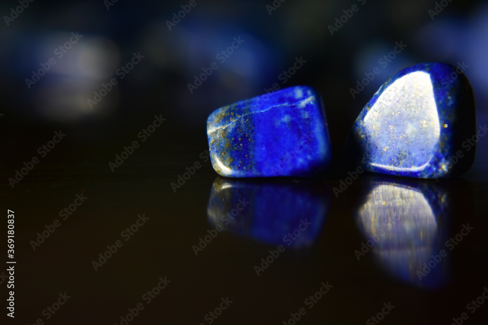 Lapis Lazuli is a beautiful blue gemstone. On areas with reflected light  Stock Photo | Adobe Stock