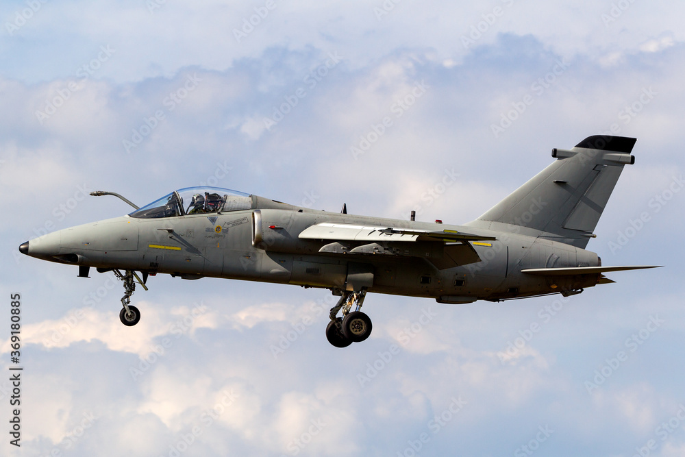 Military jet on approach to land at an Air Force base. Military jet on approach to land at an Air Force base.