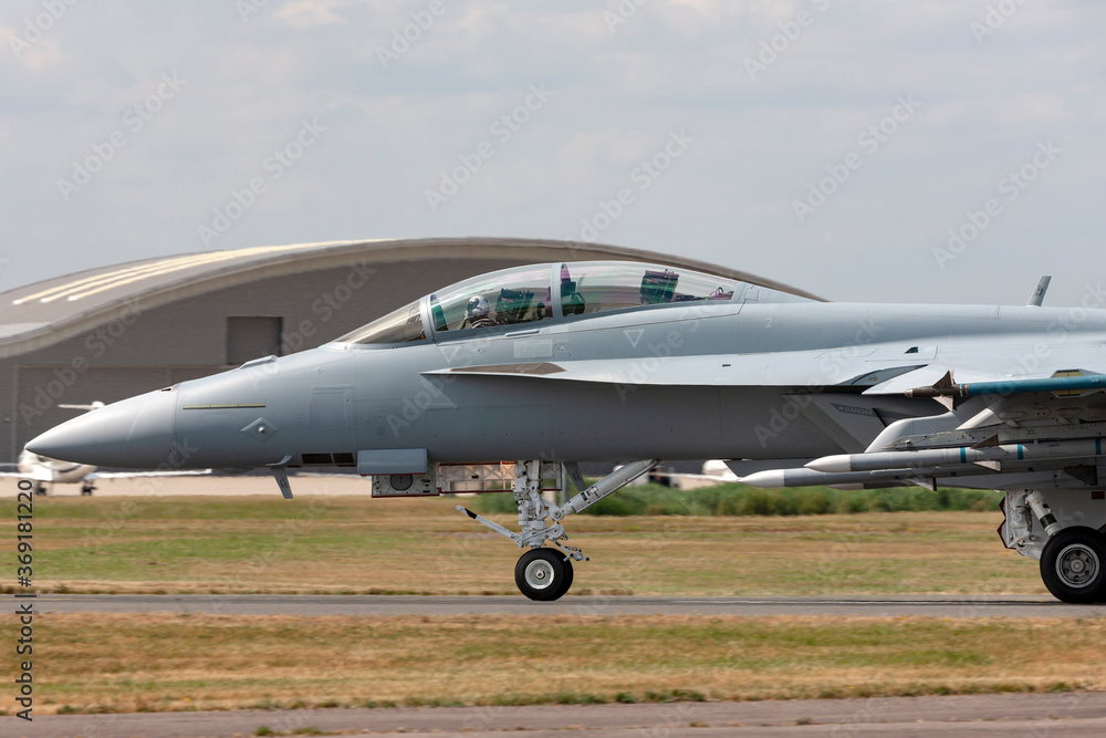Modern fighter aircraft loaded with missiles taxiing at an airport. Modern fighter aircraft loaded with missiles taxiing at an airport.