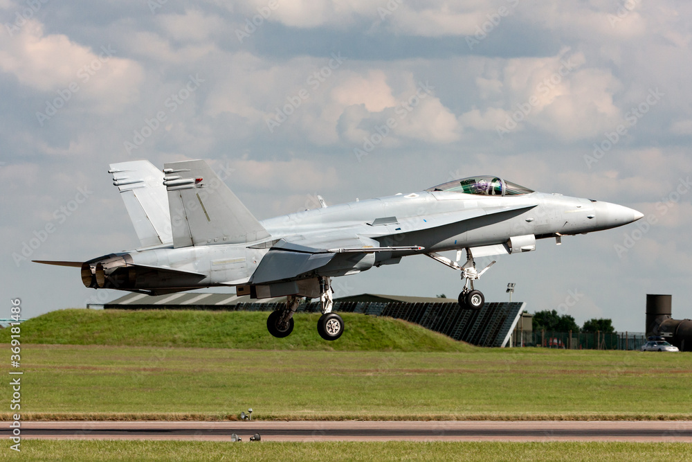 Multirole strike fighter aircraft on approach to land at an Air Force base. Multirole strike fighter aircraft on approach to land at an Air Force base.