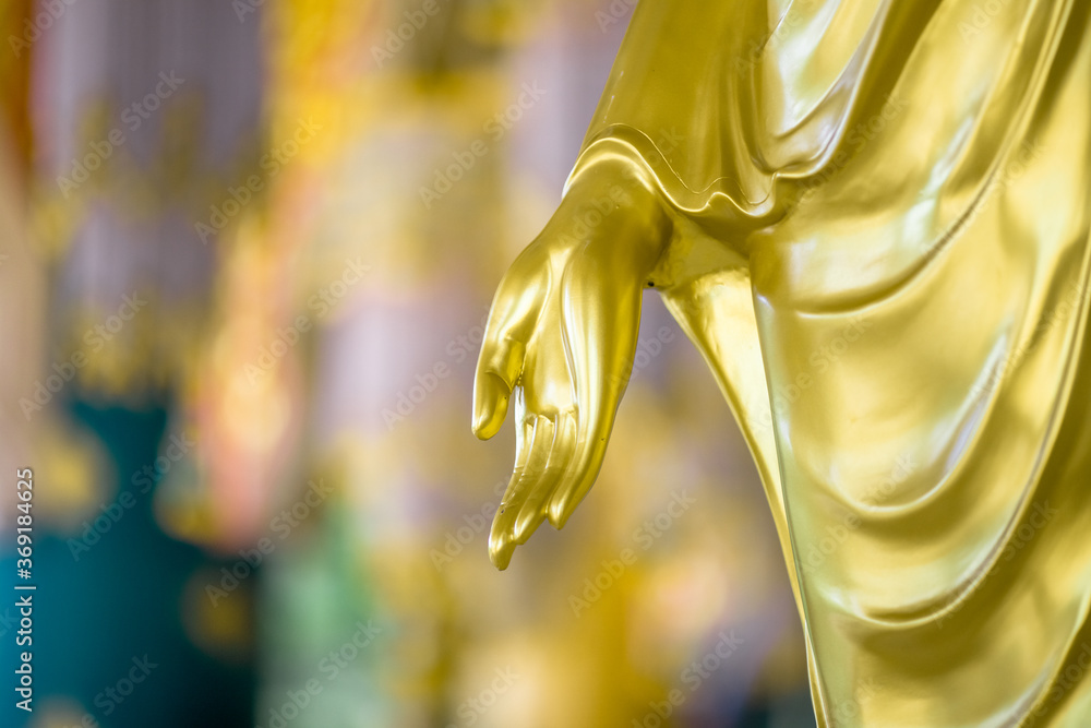 Blurred abstract background of sculptures seen at temples or religious tourist sites (Phaya Nak, Buddha statues) within Wat Pa Phu Kon in Udon Thani, Thailand