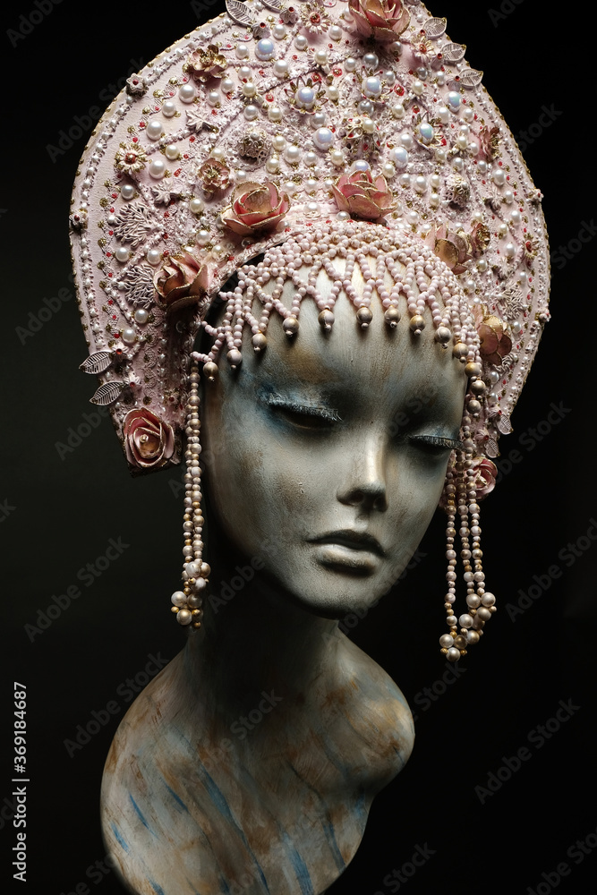 Head of mannequin in creative pink kokoshnick with jewels and pearls