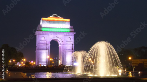 close up of a fountain and india gate at night in new delhi, india