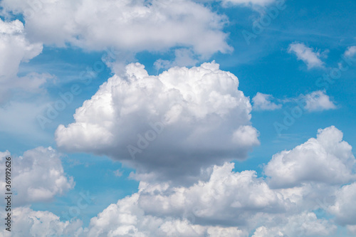 Deep blue sky and white cloud background.