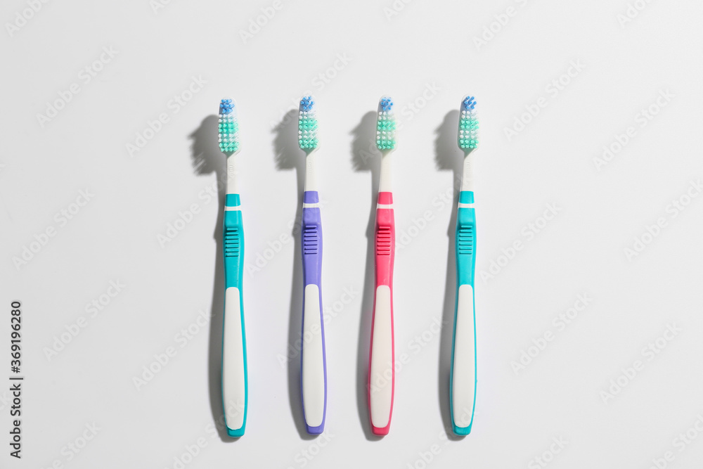 Tooth brushes on light background Tooth brushes on light background
