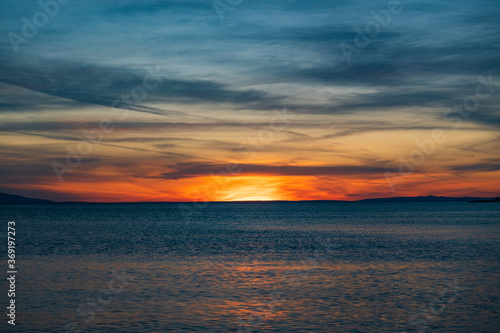 Croatia, island of Pag, beautiful dramatic sunset over Adriatic sea horizon, red sky © ilijaa