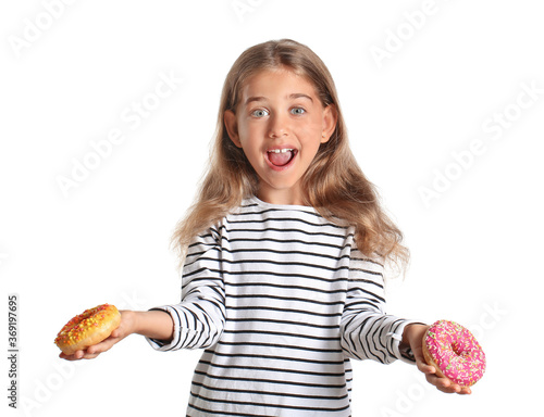 Funny little girl with donu...