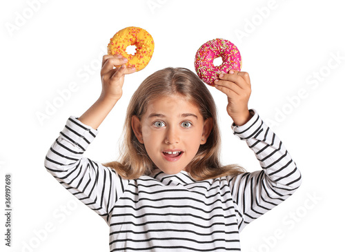 Funny little girl with donu...