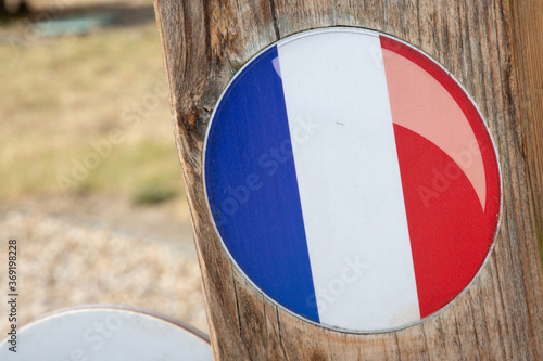 French flag of France round stickers in wooden pole in blue white red color