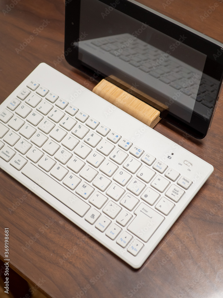 laptop on a wooden table laptop on a wooden table