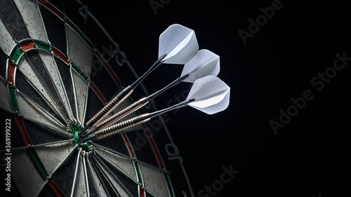 3 darts in the center of the dartboard