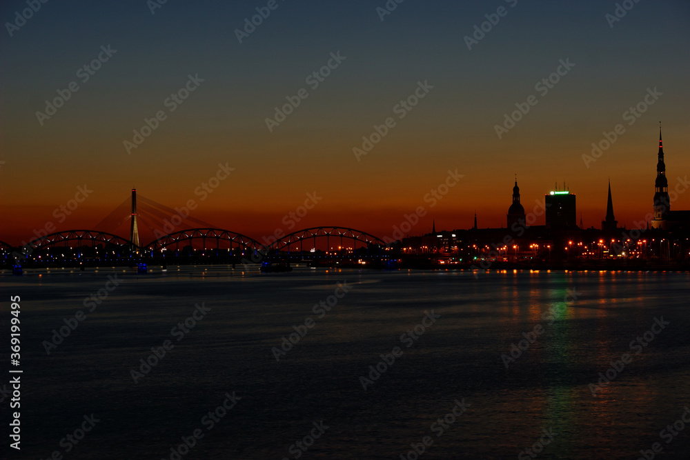 Night view city Riga on skyline background