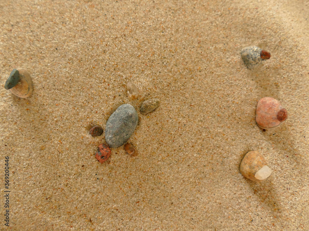 symbolic picture of helplessness with stones in sand symbolic picture of helplessness with stones in sand