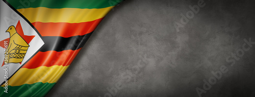 Zimbabwe flag on concrete wall banner photo