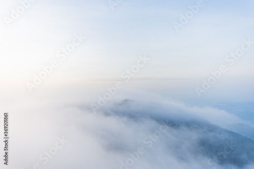 beautiful view on top mountain and mist at morning light. soft focus. © suparat1983