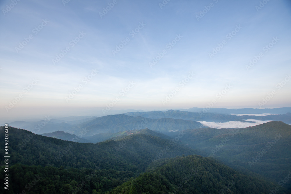 beautiful view on top mountain and mist at morning light. soft focus. beautiful view on top mountain and mist at morning light. soft focus.