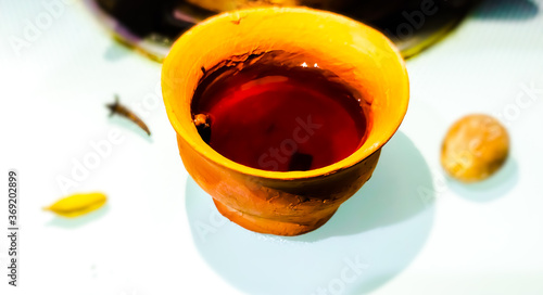 Herbal decoction (kadha) served in a clay cup. 
Used for boosting immunity.  photo