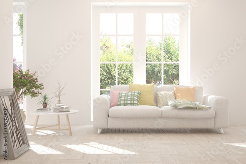 White living room with sofa and summer landscape in window. Scandinavian interior design. 3D illustration © AntonSh