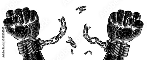 Fotografia, Obraz Hands breaking chain shackle handcuffs in a vintage woodcut revolution propaganda poster style