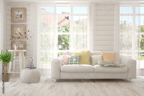 White living room with sofa and summer landscape in window. Scandinavian interior design. 3D illustration