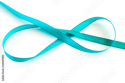 Silk ribbon. Decorative element isolated on a white background. Close-up.