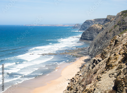 Aerial view of beach, sea and cliff. Sunny day at Cordoama beach, Algarve, Portugal. photo