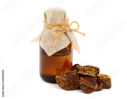 Bee Propolis Medicinal Ingredient with Tincture Extract in the Bottle Isolated on White. photo