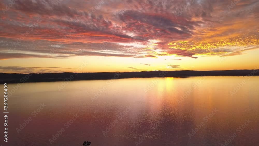 Flying over the beautiful seaside of Long Jetty wharf in Sydney during sunset - aerial Flying over the beautiful seaside of Long Jetty wharf in Sydney during sunset - aerial