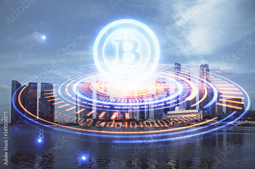 Multi exposure of cryptocurrency theme hologram drawing and city veiw background. Concept of blockchain and bitcoin. © peshkova