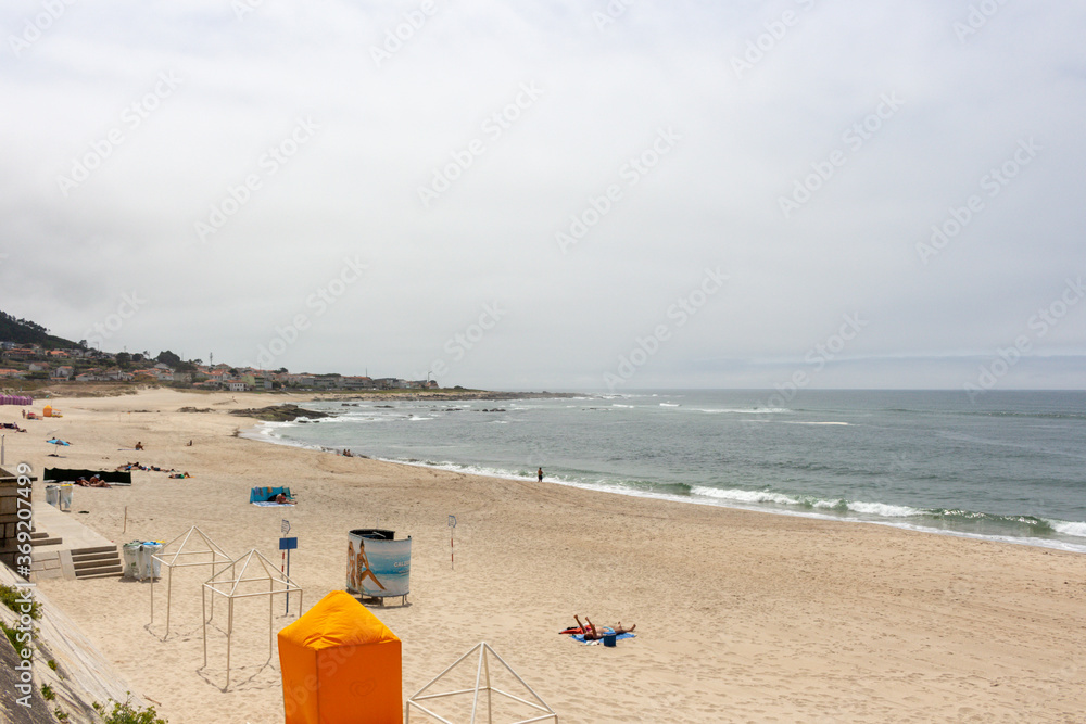 Moledo / Caminha / Portugal - July 8, 2020: The Praia de Moledo Beach. It's an Oceanic Beach in the northern hemisphere bathed by the Atlantic Ocean. Beach frequented by surfers and windsurfers. Moledo / Caminha / Portugal - July 8, 2020: The Praia de Moledo Beach. It's an Oceanic Beach in the northern hemisphere bathed by the Atlantic Ocean. Beach frequented by surfers and windsurfers.