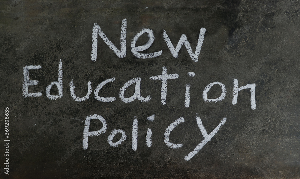 Fototapeta premium New Education Policy Phrase Written On Blackboard With White Chalk