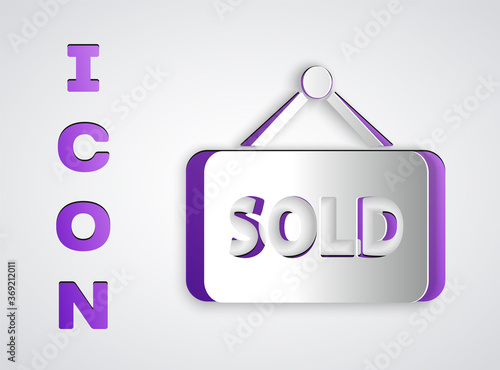 Paper cut Hanging sign with text Sold icon isolated on grey background. Sold sticker. Sold signboard. Paper art style. Vector Illustration.