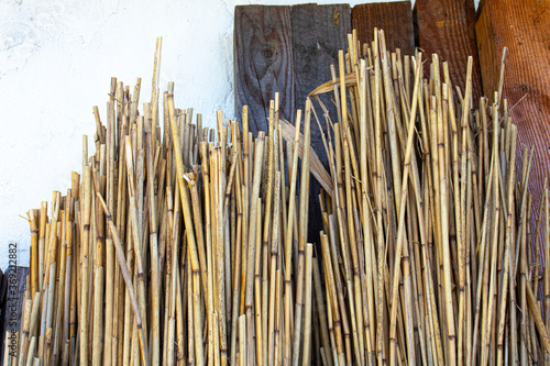 Close up view of a stack of reed near the house