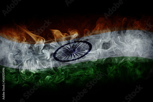 Indian flag with smoke isolated on black background photo