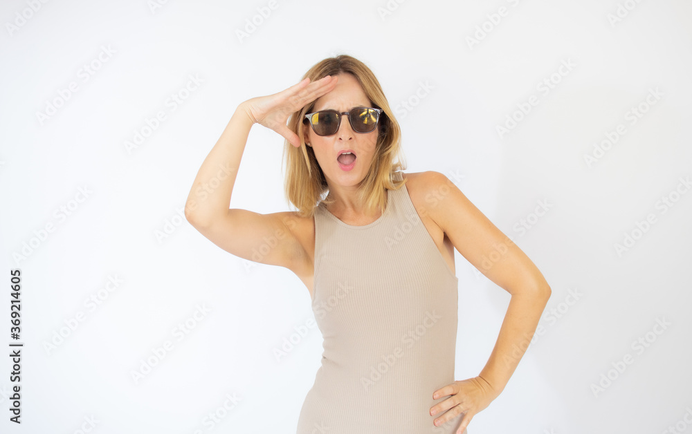 Beautiful blonde woman with sunglasses gesturing Beautiful blonde woman with sunglasses gesturing