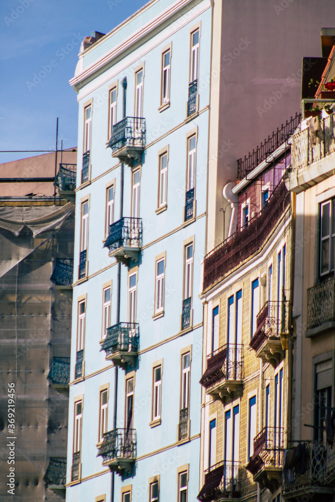 View of classic facade of ancient historical buildings in the downtown area of Lisbon, the hilly coastal capital city of Portugal and one of the oldest cities in Europe
