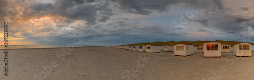 Slika na platnu Bath houses on the beach  in evening light Lokken, Northern Jutland, Denmark, Sc