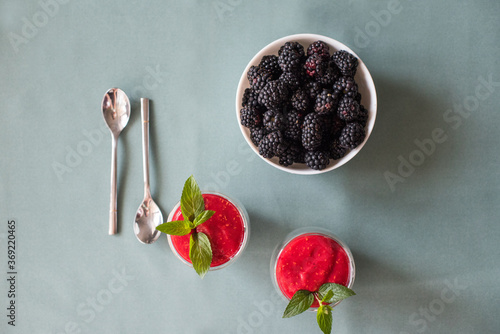 Tasty yogurts on a green table. Soft selectiv focus. Healthy desserts. Healthy concept of life photo