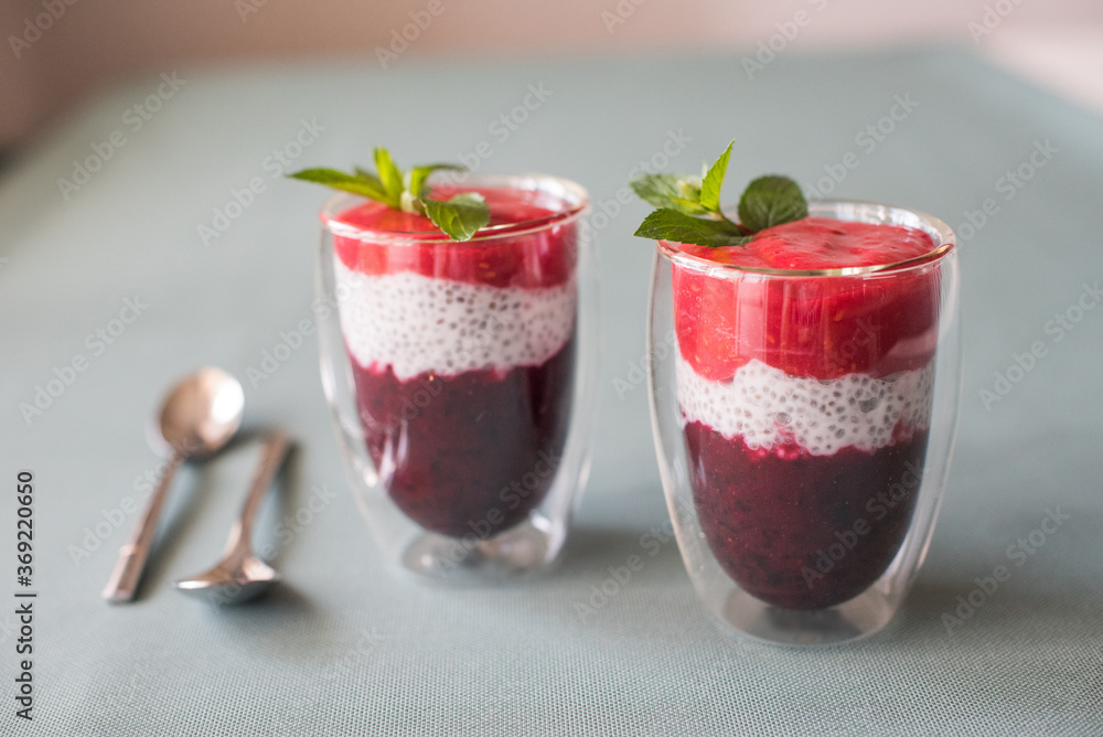 Tasty yogurts on a green table. Soft selectiv focus. Healthy desserts. Healthy concept of life Tasty yogurts on a green table. Soft selectiv focus. Healthy desserts. Healthy concept of life