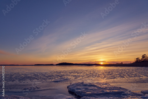 Frozen beach and icy sea on a sunset in Ruissalo  Finland.