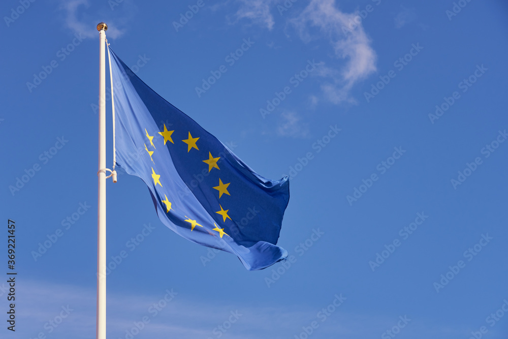Flag of Europe against a clear blue sky. Copy space. 