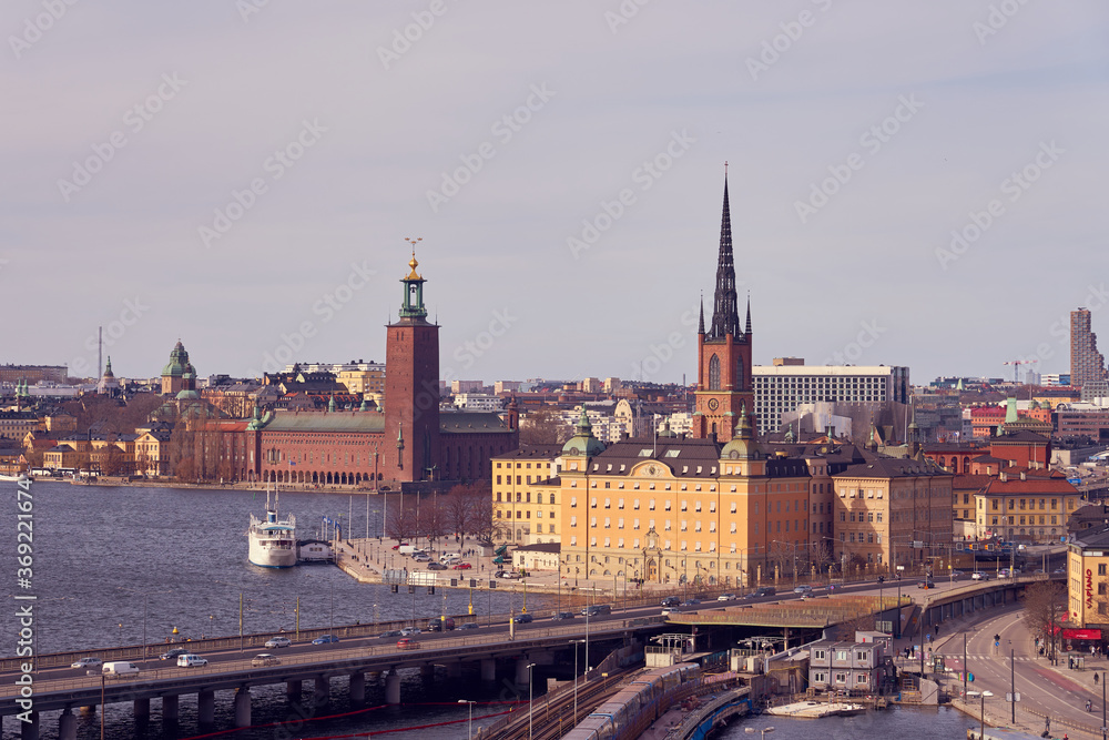 Obraz premium Gamla Stan island, an old city of Stockholm on a sunset with cloudy sky on the background.