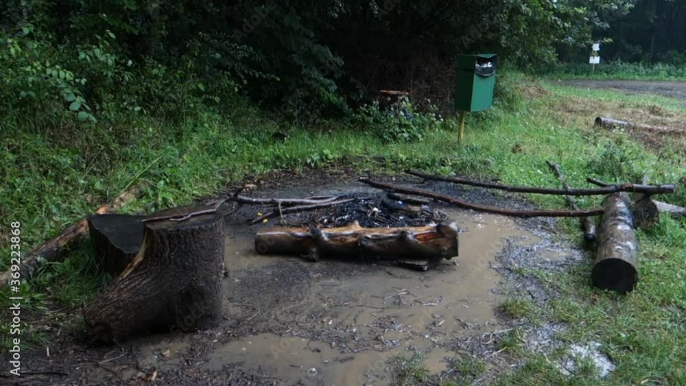 Strong summer storm extinguish and wet ember on camping site Strong summer storm extinguish and wet ember on camping site