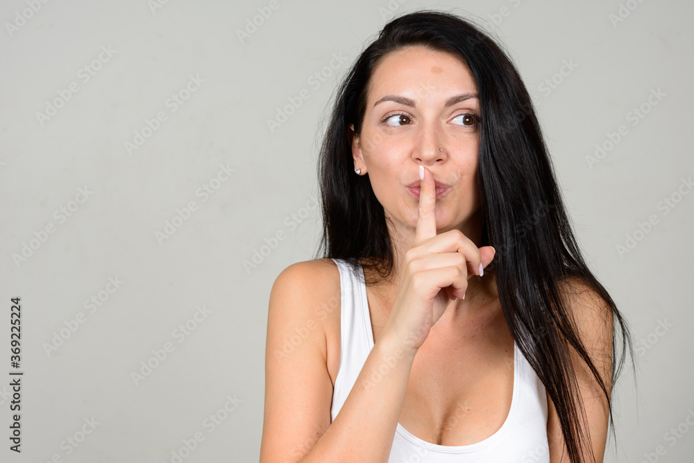 Portrait of beautiful woman against white background Portrait of beautiful woman against white background