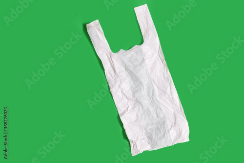 white plastic bag on green background