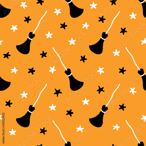 Cute bright Halloween seamless pattern with brooms and stars. Vector illustration ideal for festive background, decoration, cards, wallpaper, wrapping paper, prints, and fabrics or textile design.