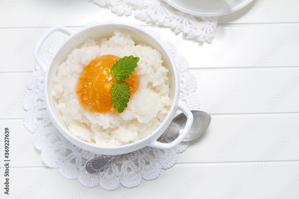 Rice porridge with orange marmalade and lemon balm leaves Rice porridge with orange marmalade and lemon balm leaves