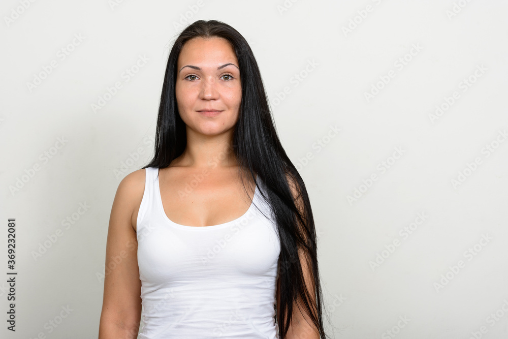 Portrait of beautiful woman against white background Portrait of beautiful woman against white background