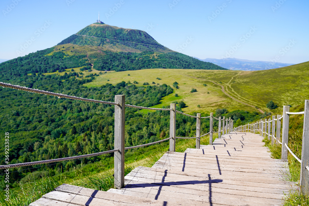 wooden staircase for access to the Puy de Dôme volcano in Auvergne france