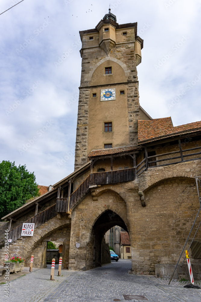 a view of one of the many city gate guard towers in the medieval Bavarian city of Rothenburg ob der Tauber